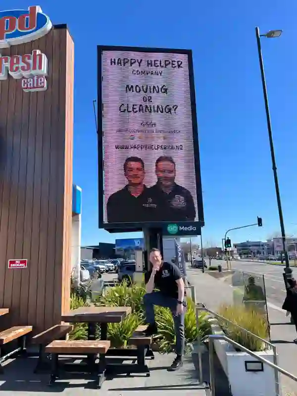 Happy Helper billboard by the café